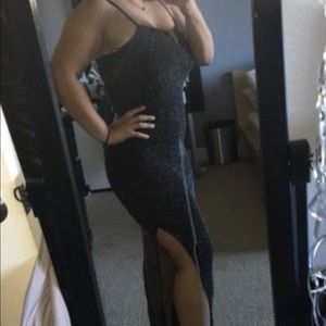 A black sparkly slit dress